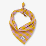 Yellow and pink checkered bandana with a brand label on a white background