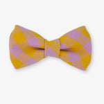 Checkered bow tie with pink and yellow pattern on a white background