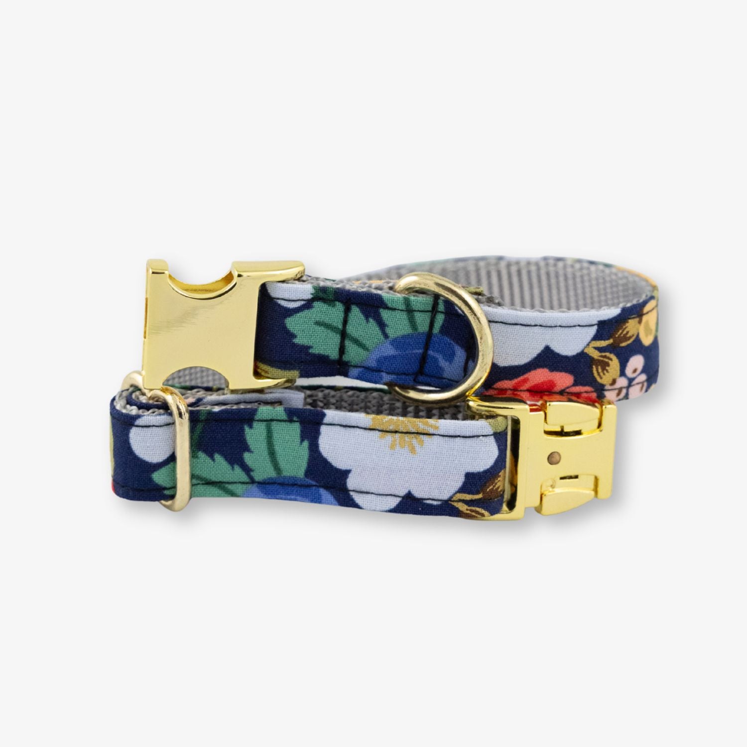 Floral-patterned dog collar with gold buckle on a white background