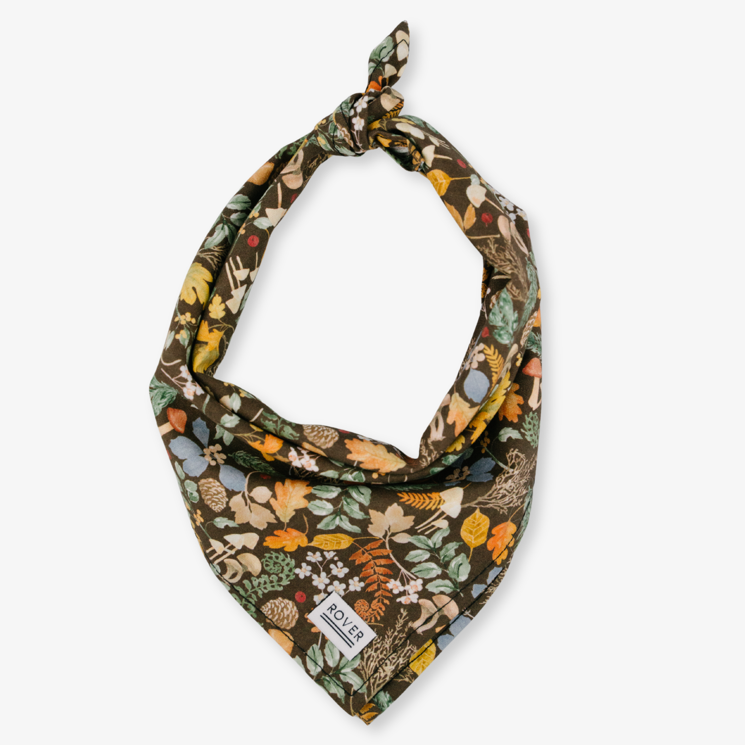 A square bandana with a detailed autumn forest print, tied in a loop at the top and featuring a small white POLR PAQ brand tag near the bottom corner, set against a plain light gray background.
