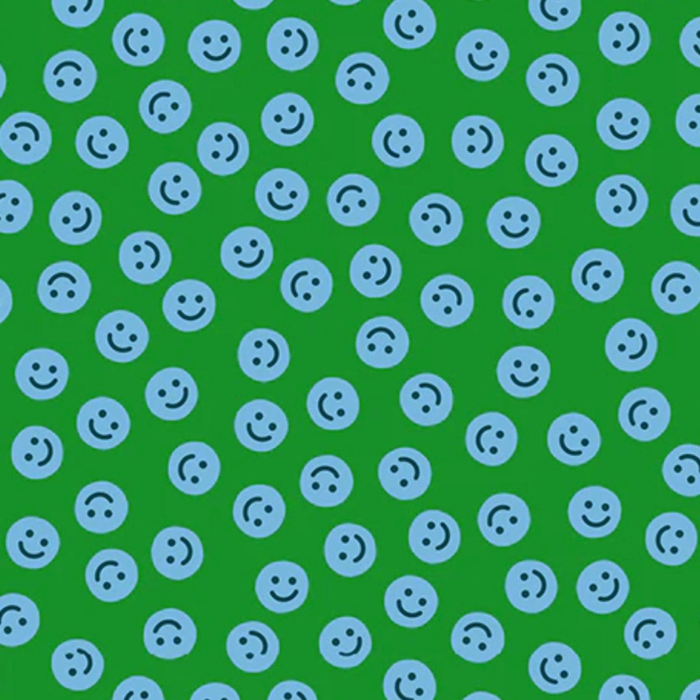 Pattern of blue smiley faces on a green background